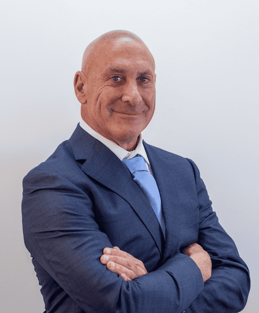 florida brain injury lawyer scott senft smiling with arms crossed