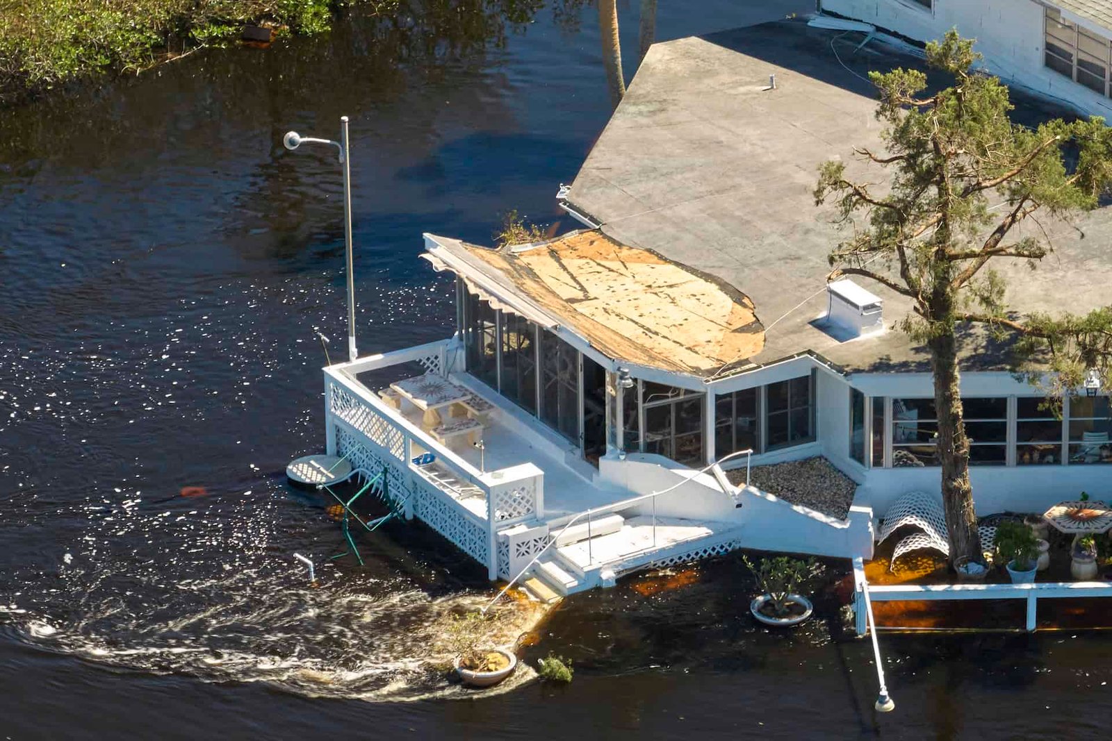 Hurricane Ian flooded houses in Florida residential area. Natural disaster and its consequences.