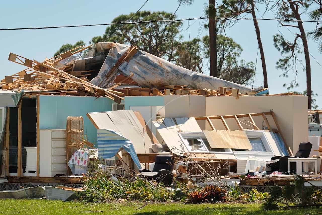 Severely damaged by hurricane Ian house in Florida mobile home residential area. Consequences of natural disaster. needs hurricane damage attorney